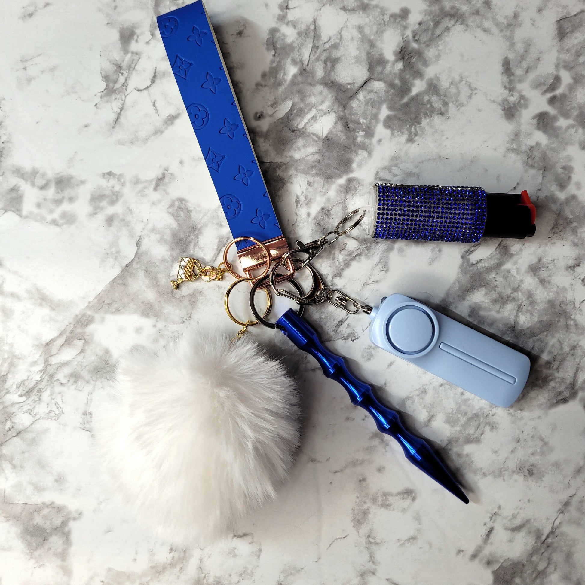 Blue Embossed White Pompom Faux Leather Self-Defense Keychain.