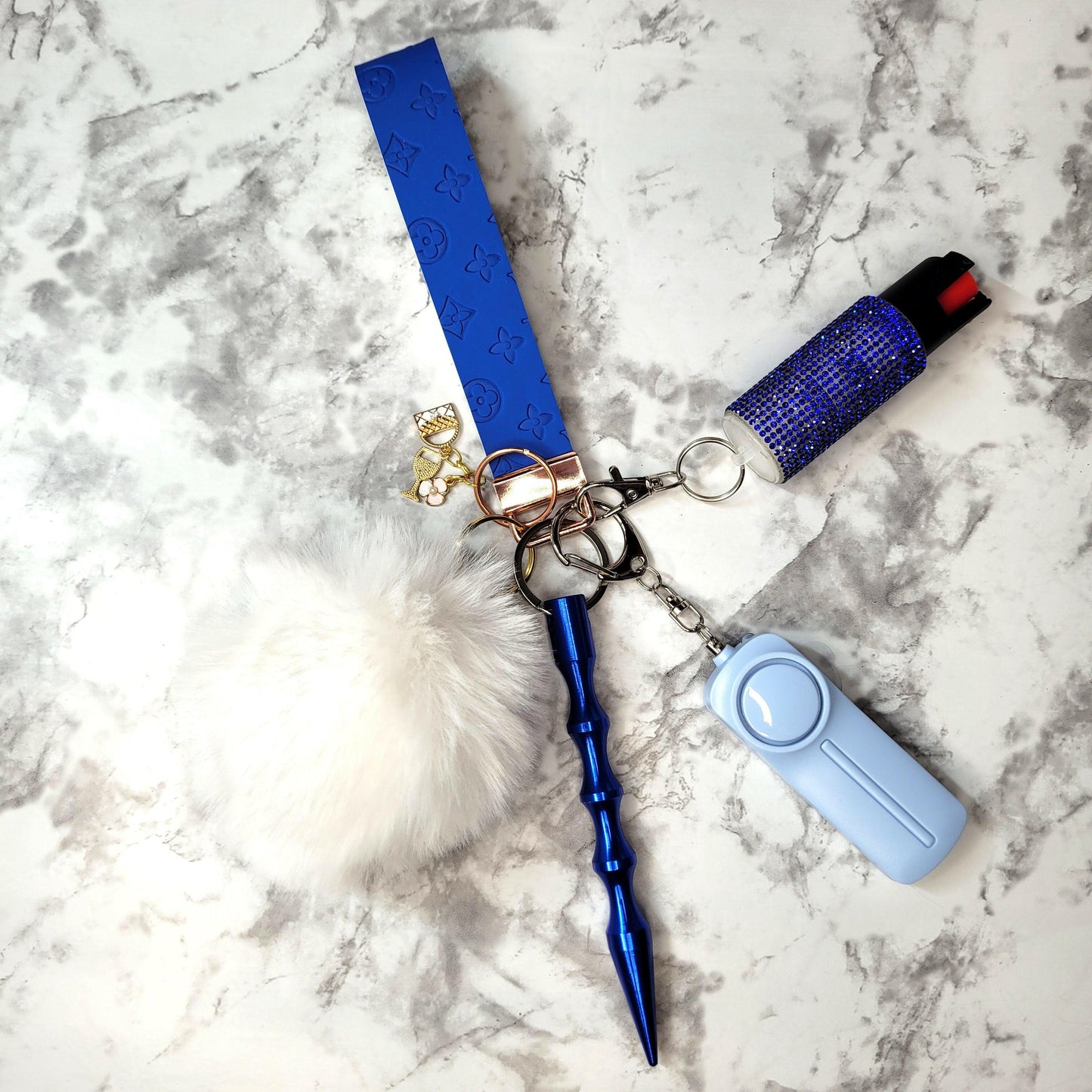 Blue Embossed White Pompom Faux Leather Self-Defense Keychain.