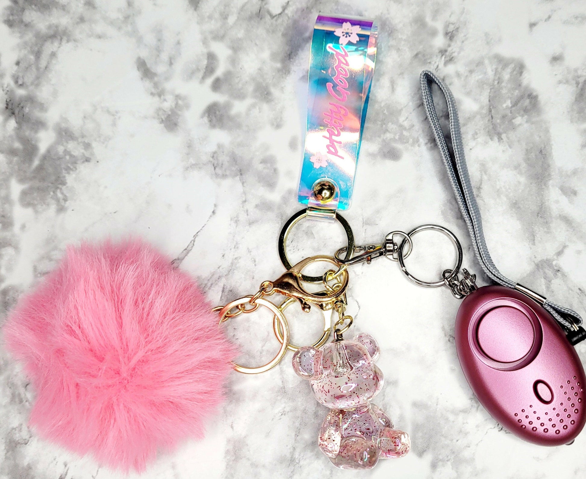 Iridescent Wristlet with Bear Pink Pompom Keychain.