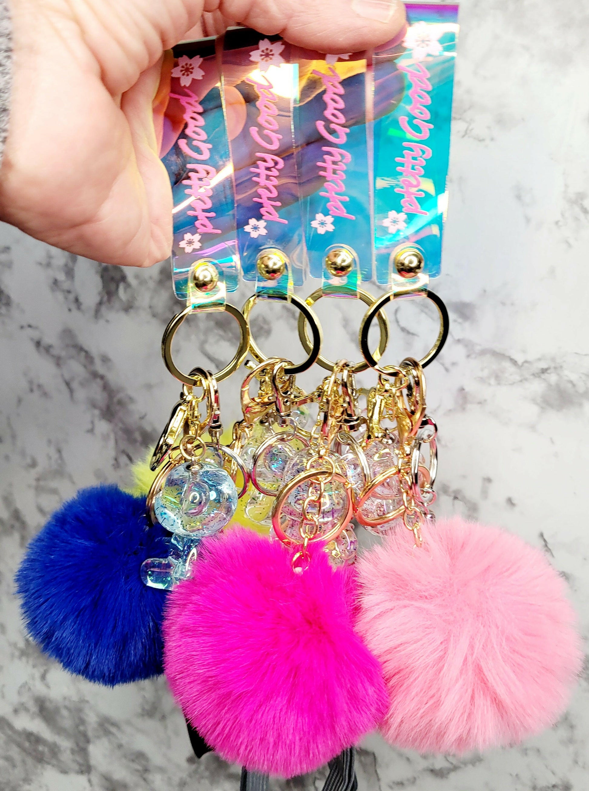 Iridescent Wristlet with Bear Pink Pompom Keychain.