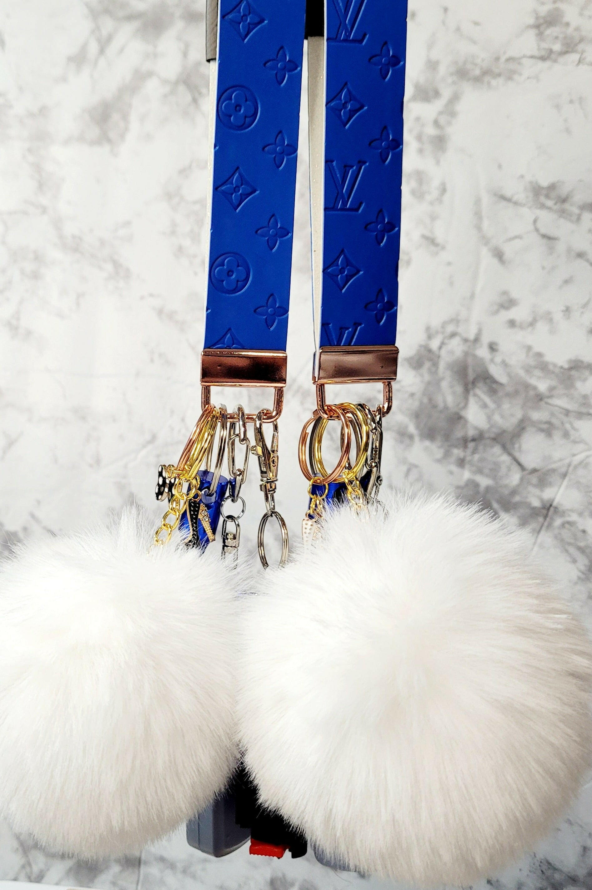 Blue Embossed White Pompom Faux Leather Self-Defense Keychain.