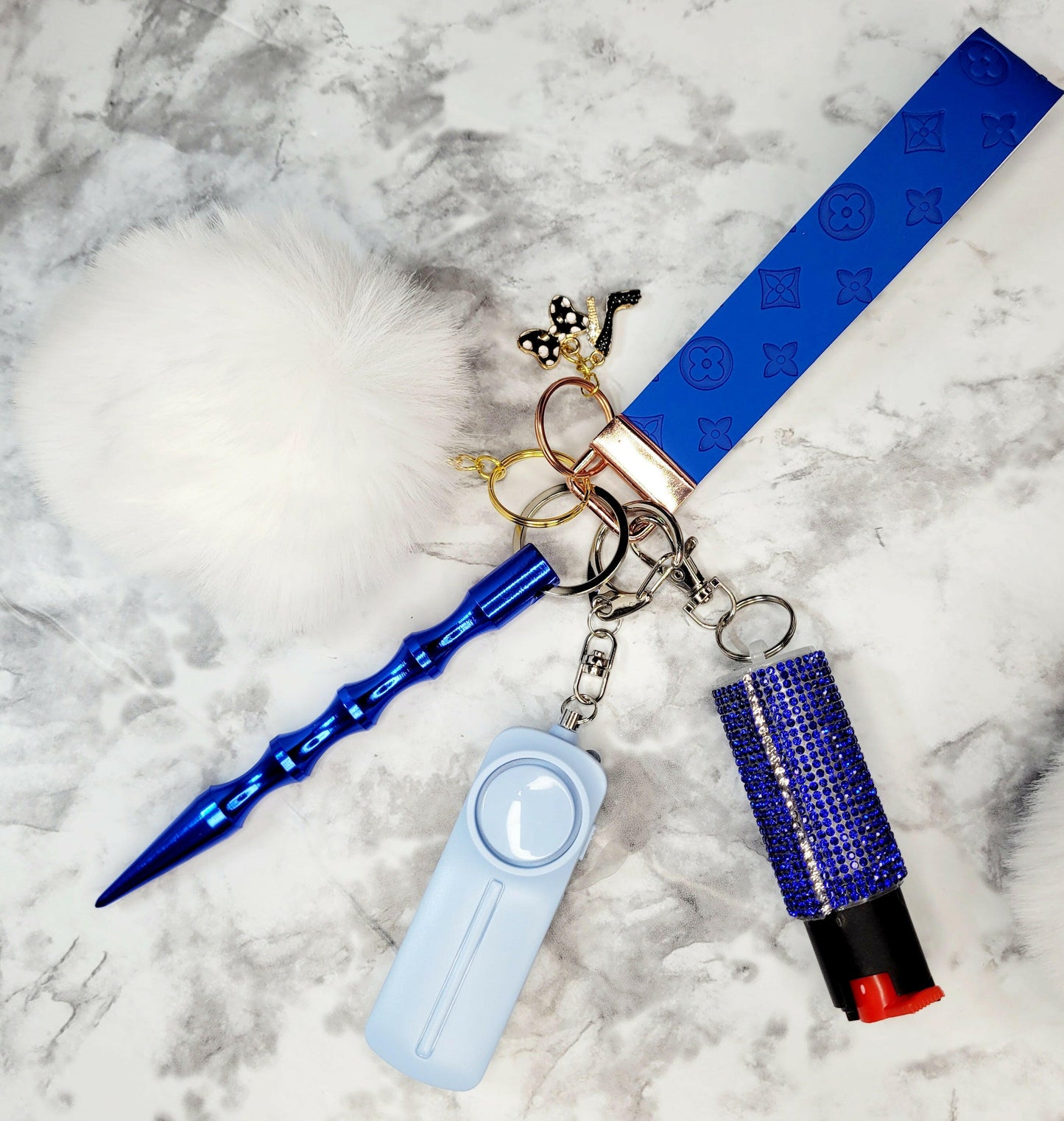 Blue Embossed White Pompom Faux Leather Self-Defense Keychain.